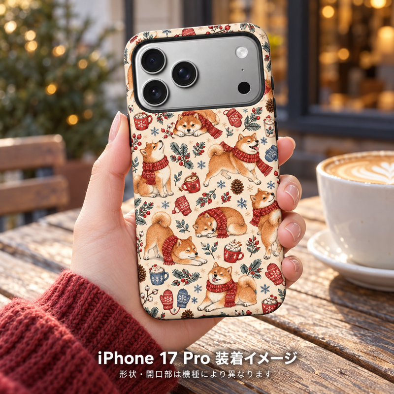 マフラー柴犬(レンガレッド)柄のケースを装着したiPhone 17 Proを手に持つ装着イメージ