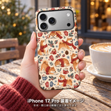 マフラー柴犬（レンガレッド）柄のケースを装着したiPhone 17 Proを手に持つ装着イメージ
