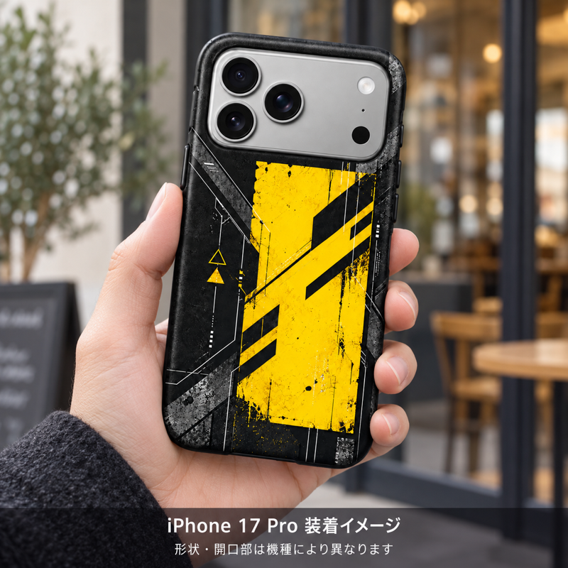 ブラックイエローモジュール柄のケースを装着したiPhone 17 Proを手に持つ装着イメージ