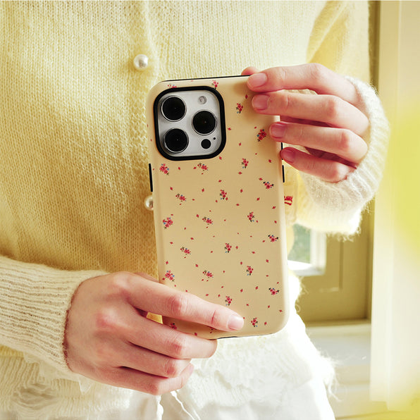 Magnetic smartphone case with a small floral print, rotating ring stand, and double-layer film construction